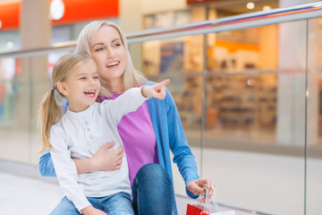 Mother and daughter shopping in mall