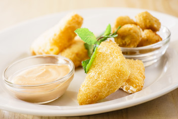 fried cheese with sauce