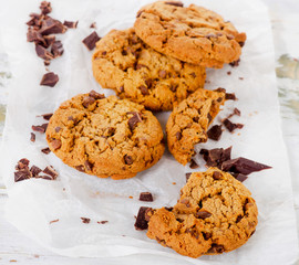 Chocolate chip cookies on a baking paper.