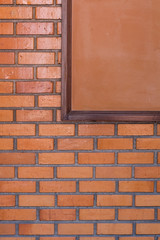 blank noticeboard message on brick wall background