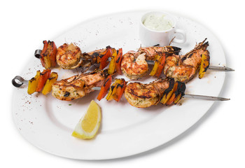 Delicious grilled shrimps on skewers.