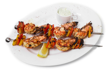 Delicious grilled shrimps on skewers.
