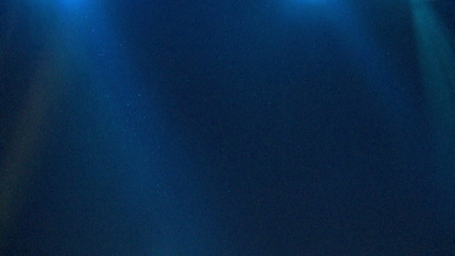 Light rays on a blue background ,loop blue abstract background