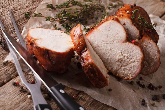 Homemade Sliced Roasted Turkey Close-up On Paper. Horizontal