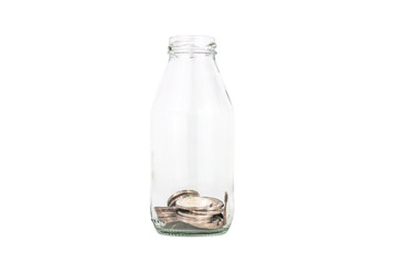 saving thailand coins in open bottle white background