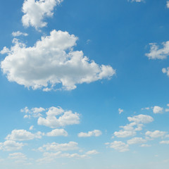 Naklejka na ściany i meble white cumulus clouds against the blue sky