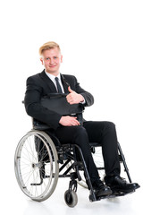 young businessman in a wheelchair with thumb up
