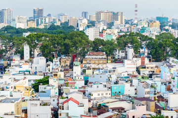 Fototapeta premium Downtown Saigon in sunset, Ho Chi Minh city, Vietnam. Ho Chi Minh city is the largest city and economic center in Vietnam with population around 10 million people.