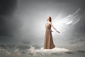 Fototapeta na wymiar Angel girl flying high
