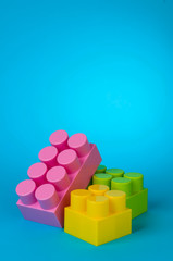 Toy brick on blue