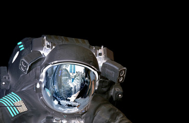 Astronaut et alien extraterrestrial helmet isolated on black spaceman space suit. Elements of this image furnished by NASA.