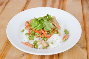 pork and vegetable fried on hot rice - Thailand healthy food