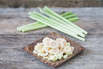 Fresh lemongrass slices on wooden background - Spice for health.