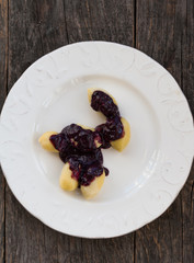 Cheese gnocchi with blueberry sauce