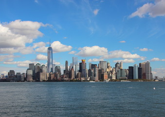 Fototapeta na wymiar Manhattan Downtown Skyline from Seaside with Blue Sky