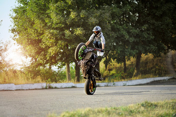 Obraz premium Training hard. Action soft smudged focus shot of a stuntman doing a trick on his motorbike copyspace on the side