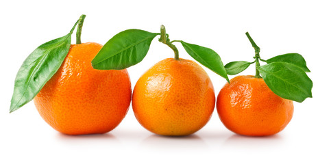 Tangerines with green leaves isolated on white background