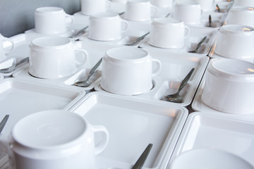 Abstract blurred of many rows of coffee or tea cups for backgrou