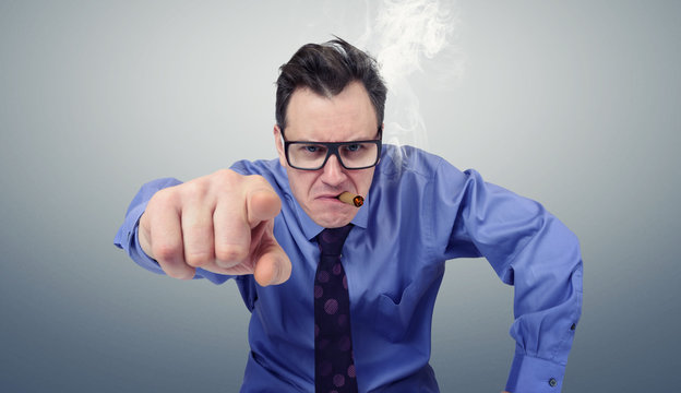 Angry businessman with glasses and cigar