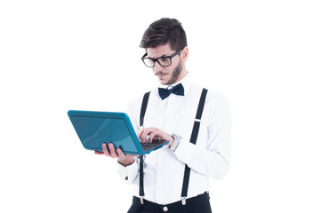 Young business man looking at his laptop with disappointment