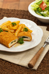 Chicken Kiev Cutlet. Boneless chicken breast with butter and herbs. Selective focus.