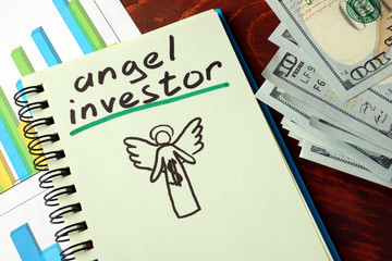 Notebook with  angel investor sign.  Business concept.