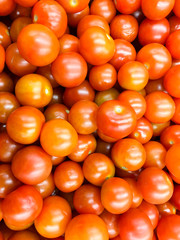 Red Cherry Tomatoes Group For Sale In Vegetable Market