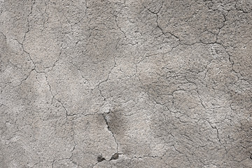 Cracked Concrete Vintage Wall Background / Detail of an old wall in grey cement with many cracks
