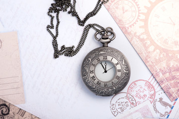 Old clock on a chain. Vintage card