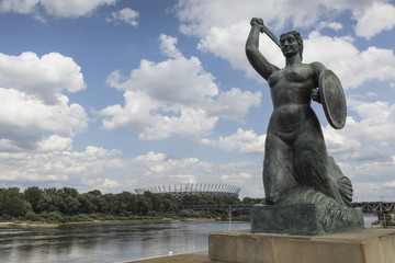 The Warsaw Mermaid called Syrenka on the Vistula River bank in W © Curioso.Photography