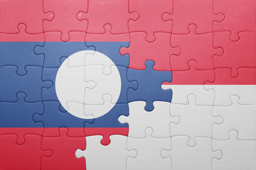 puzzle with the national flag of indonesia and laos