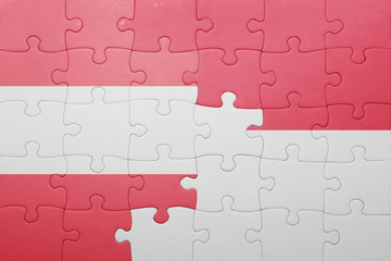 Fototapeta premium puzzle with the national flag of indonesia and austria