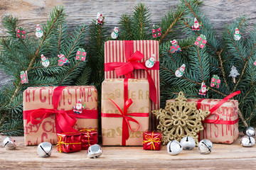 Fototapeta na wymiar Christmas tree and gifts on wooden background. Copy space 