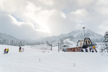 scenic view of small people play ski in snow mountain,Washington,USA.