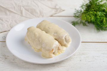stuffed cabbage with white sauce and dill