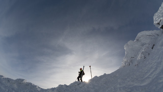 skier on a mountain ridge in the winter