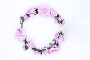 wreath of pink flowers on a white background