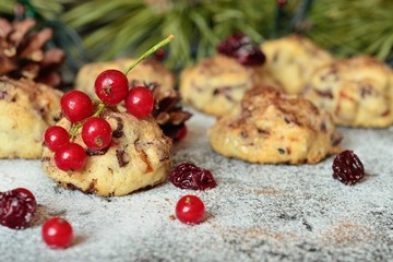 red currants and homemade Christmas cookies with chocolate and dried berries