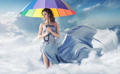 Conceptual portrait of the woman in the sky