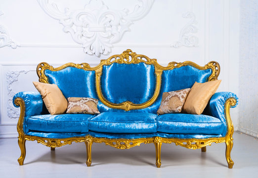 Blue Sofa In Baroque Style In A White Room
