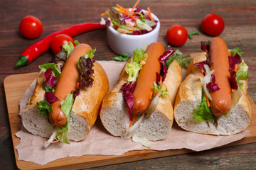 home made Hot dog - sandwich with lettuce on wooden background