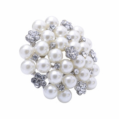 round brooch with pearls isolated on white