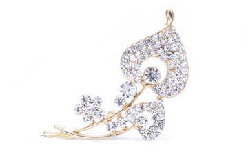 gold brooch with diamonds isolated on white