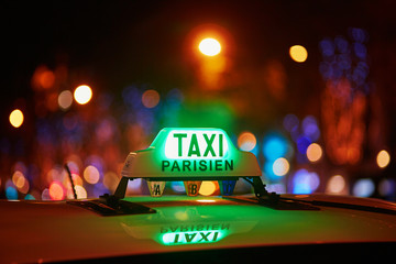 Green taxi sign in Paris, France