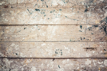 Old grungy wooden wall with paint splashes, background
