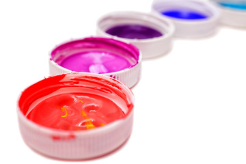 Colorful acrylic paints in covers