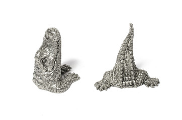 salt and pepper shakers in the form of a crocodile Isolated on w