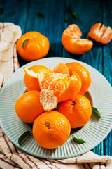 fruit, citrus , fresh, ripe and juicy tangerines on a wooden background