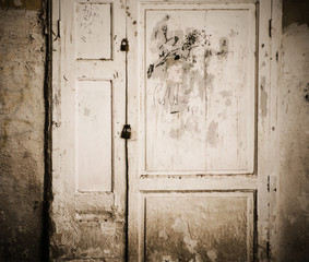old rusty door with a graffiti