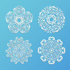 Set of ornamental snowflakes. Indian mandala style. Element for design. Round lace. It can be used for decorating of invitations, cards, decoration. Christmas vector illustration